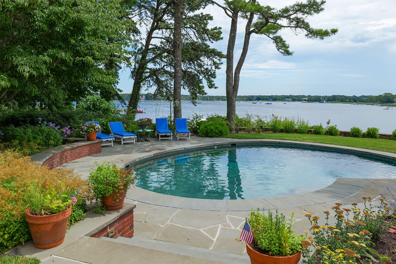 CMS Landscape A Waterfront Estate Rooted in Legacy, Refined for Today, a new project feature from CMS Landscape. This property includes a stunning backyard that lines the waterfront with a beautiful patio and swimming pool and lots of flowers and shrubs.