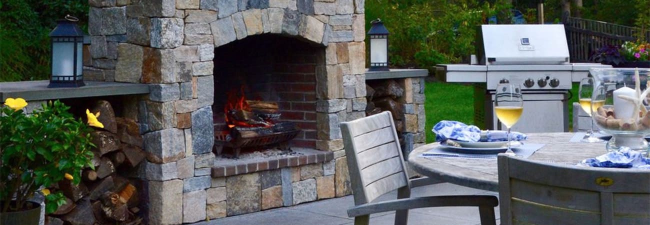 CMS Landscape A Cape Cod Outdoor Living Space Designed for Effortless Entertaining, a new project feature from CMS Landscape. This home includes a stunning backyard kitchen and sitting area that's perfect for cooking out and hosting friends by the fireplace.