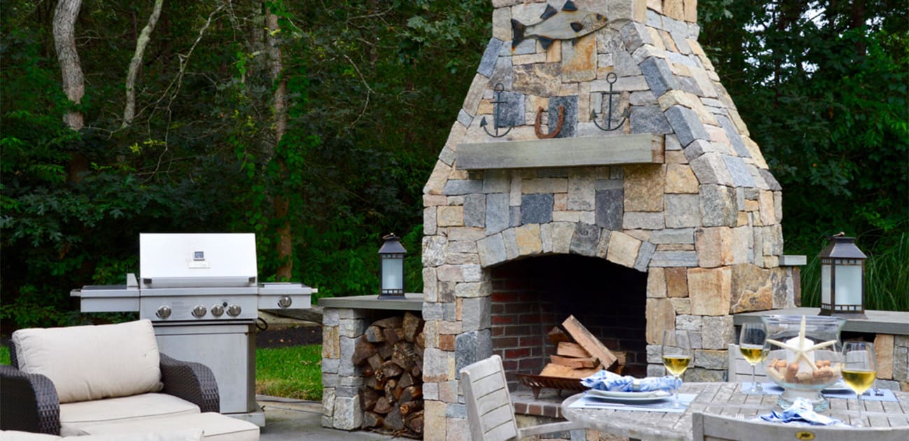 CMS Landscape A Cape Cod Outdoor Living Space Designed for Effortless Entertaining, a new project feature from CMS Landscape. This home includes a stunning backyard kitchen and sitting area that's perfect for cooking out and hosting friends by the fireplace.