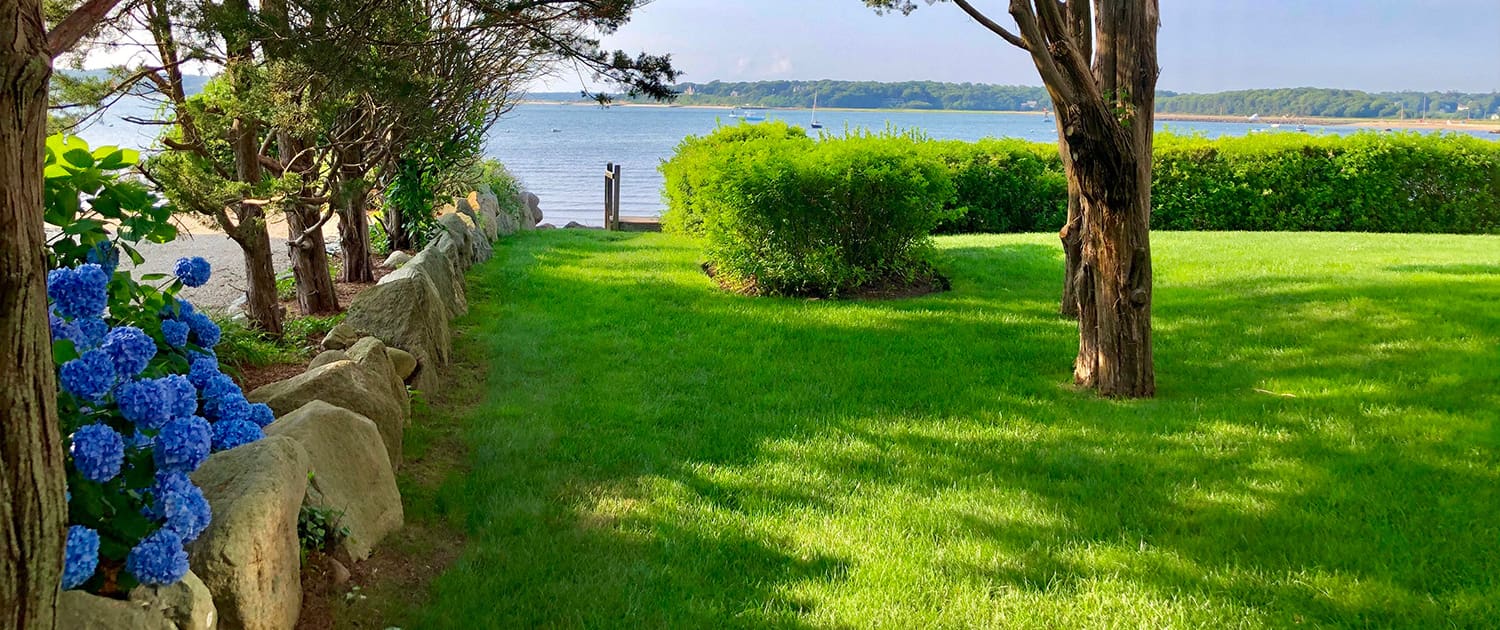 A beautiful landscaping project with views of the water, built, designed, and maintained by CMS Landscape