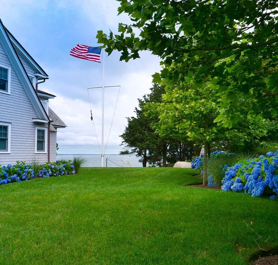 A beautiful waterfront property landscape managed by CMS Landscape