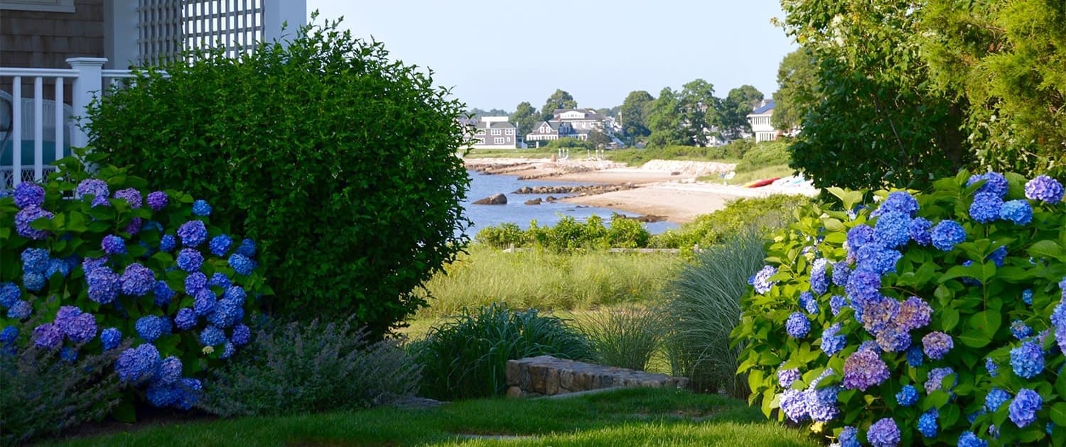A beautiful landscaping project with views of the water, built, designed, and maintained by CMS Landscape