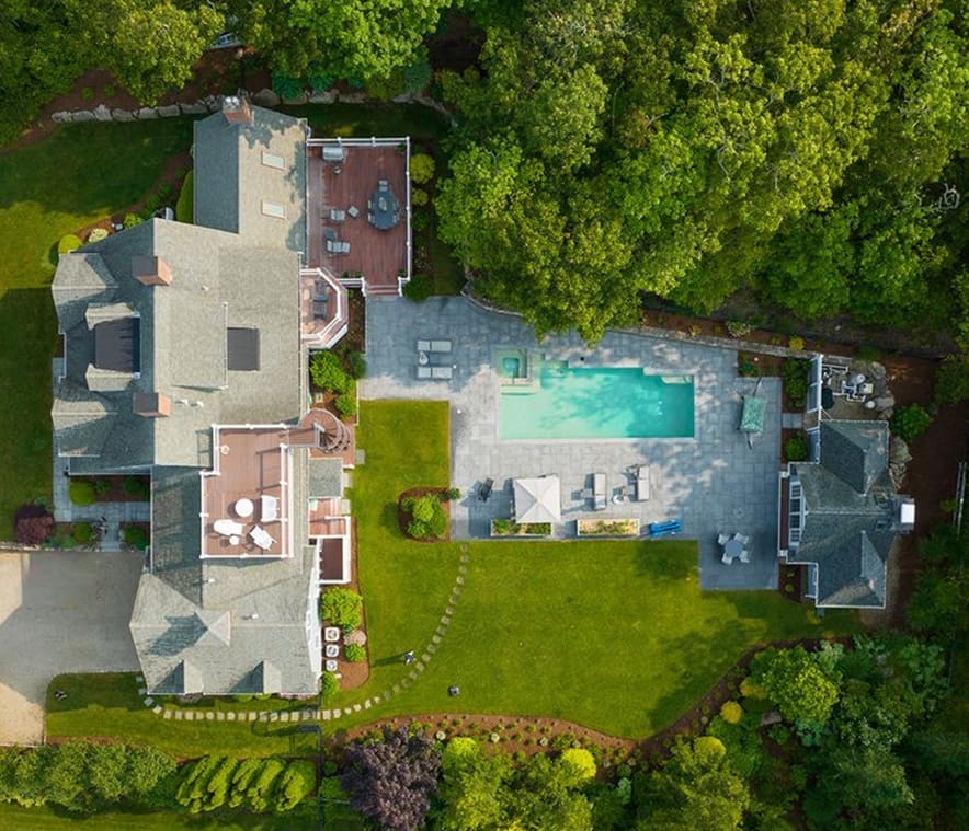CMS An aerial view of a home with a pool. This property is managed by CMS Landscape